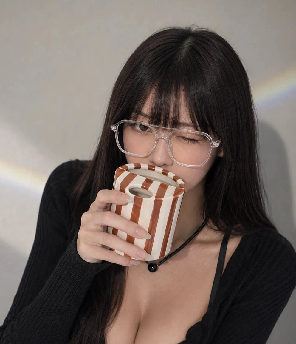 JMCRATE striped ceramic cup held by Mei Lin