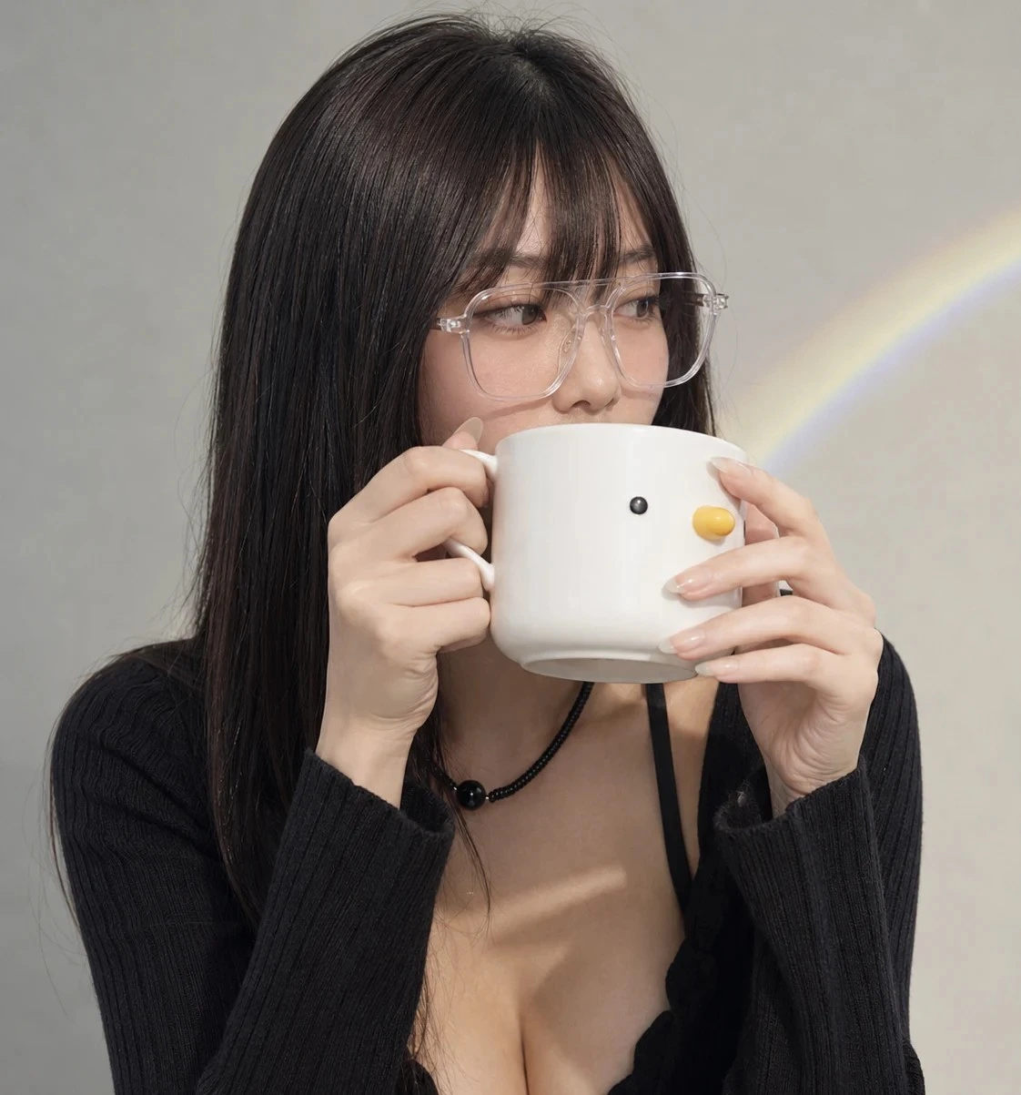 Minimal white duck breakfast mug held by Mei Lin